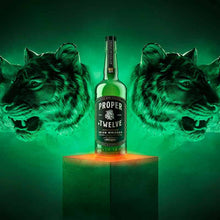 Load image into Gallery viewer, A bottle of Proper Twelve Irish Whiskey  with a green background with tigers on it
