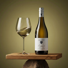 Load image into Gallery viewer, Bottle of Raats Original Chenin Blanc wine and glass on a wooden platform with a green background