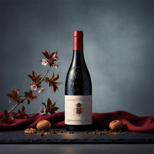 Load image into Gallery viewer, A bottle of Raymond Usseglio Fils Chateauneuf du Pape wine on a dark surface with a red cloth and decorative elements.