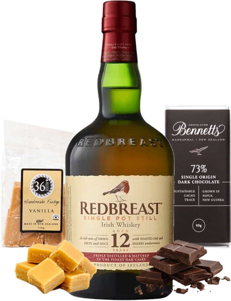 Redbreast Irish Whiskey bottle with chocolate and fudge on a white background