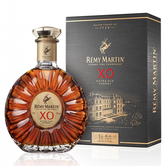 Load image into Gallery viewer, A bottle of Rémy Martin XO Extra Old Cognac next to its dark grey and gold gift box packaging box, set against a clean white background with a subtle reflection.