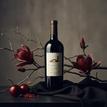 Load image into Gallery viewer, Mondavi_Napa Cabernet Sauvignon wine bottle with a label on a dark surface with floral branches and fruits.