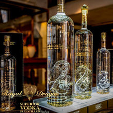 Load image into Gallery viewer, Bottles of Royal Dragon Superior Vodka on a table with a blurred background