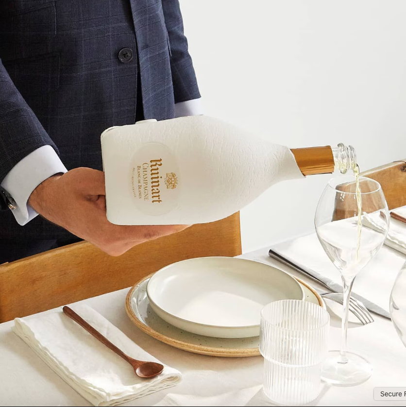 Load image into Gallery viewer, A man pouring champagne in to a glass