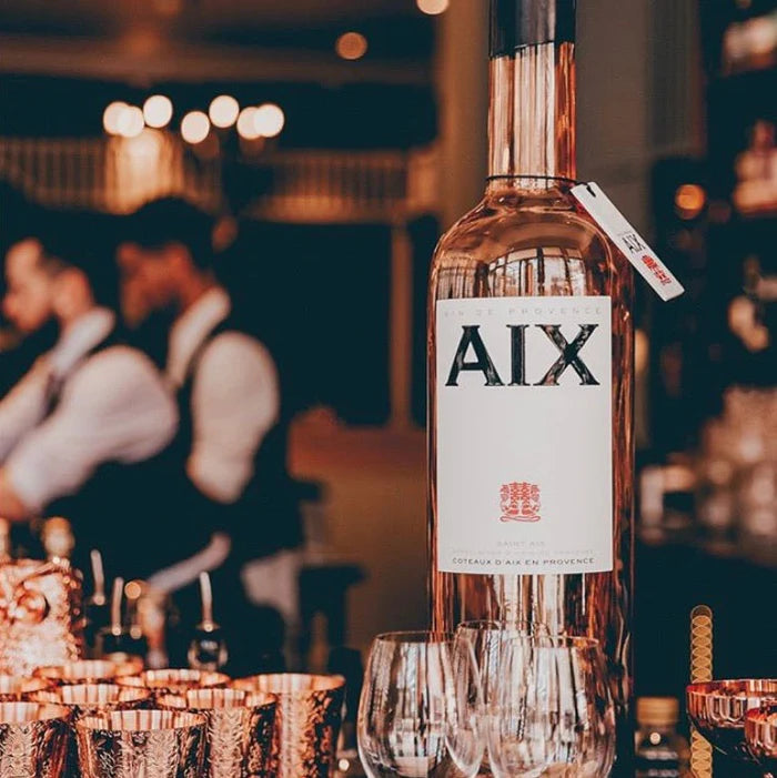 Load image into Gallery viewer,  A bottle of Saint AIX Provence Rosé Jeroboam 3Litre in a bar 