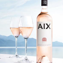 Load image into Gallery viewer, Magnum bottle of AIX rosé wine with two glasses against a scenic background