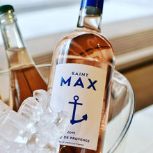 Load image into Gallery viewer, Bottle of Saint Max rose wine in a glass ice bucket with ice on table