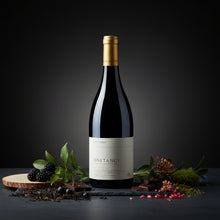 Load image into Gallery viewer, A bottle of Sam Harrop Onetangi Waiheke Island syrah wine with decorative elements on a dark background