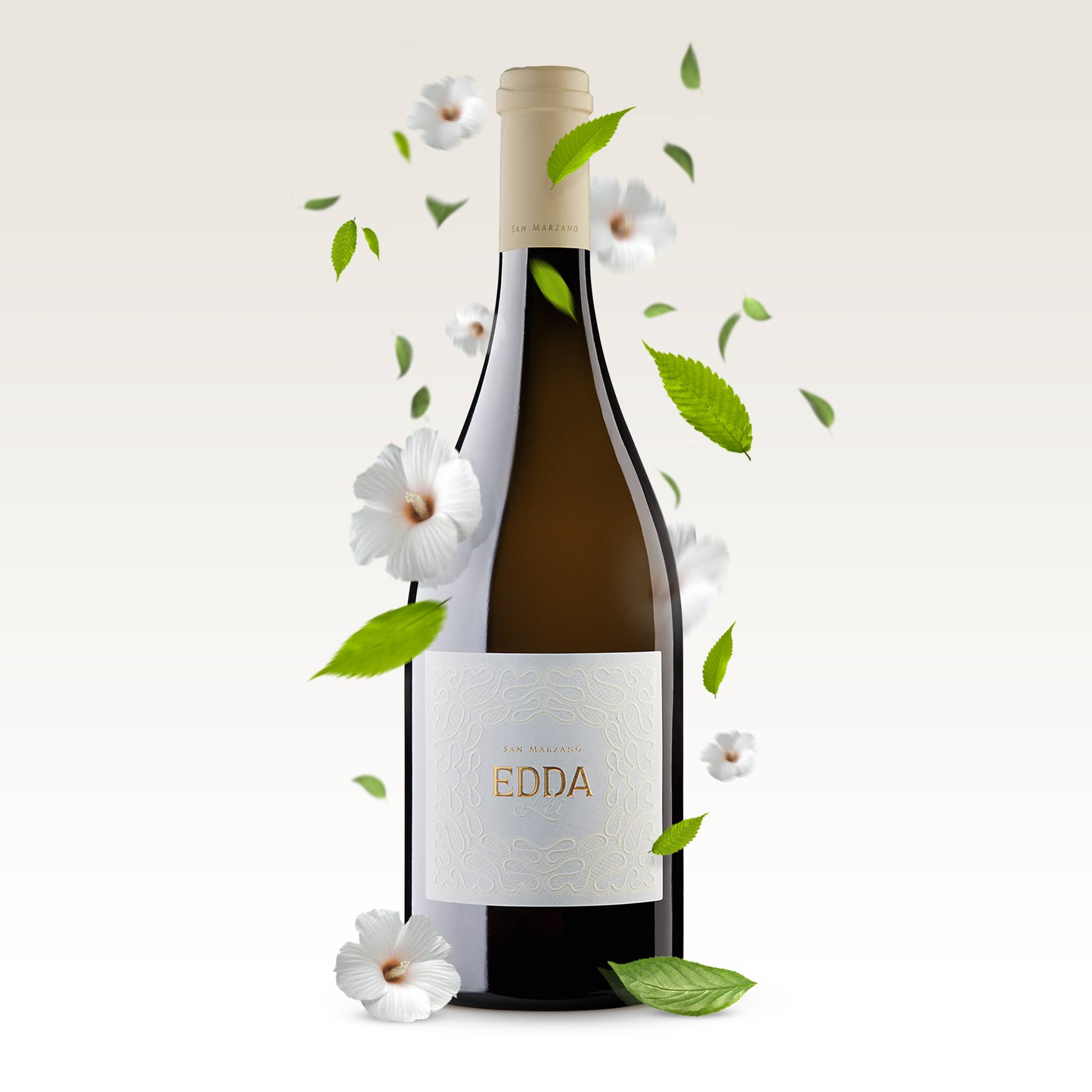 Load image into Gallery viewer, A bottle of white Italian wine with white flowers and leaves around it on a white background