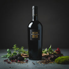 Load image into Gallery viewer, Bottle of A bottle of San Marzano Sessantanni Primitivo red wine with decorative elements on a dark background