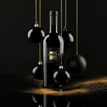 Load image into Gallery viewer, A bottle of San Marzano Sessantanni Primitivo surrounded by hanging decorations