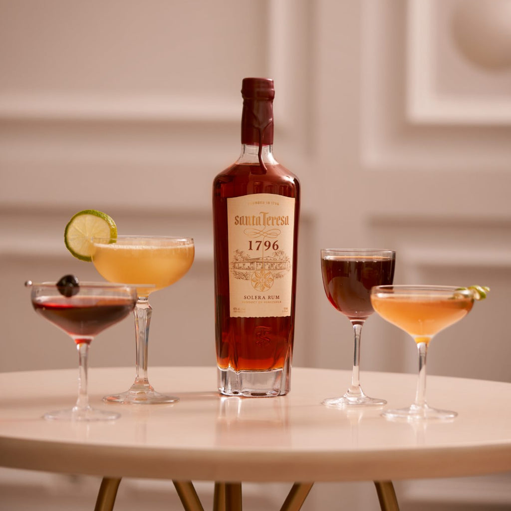 Bottle of Santa-Teresa-1796-Rum with cocktails on a table