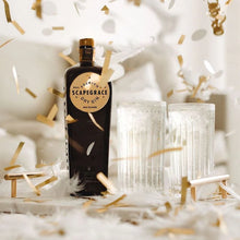 Load image into Gallery viewer, Bottle of Scapegrace Gold Dry Gin with decorative elements on a white background