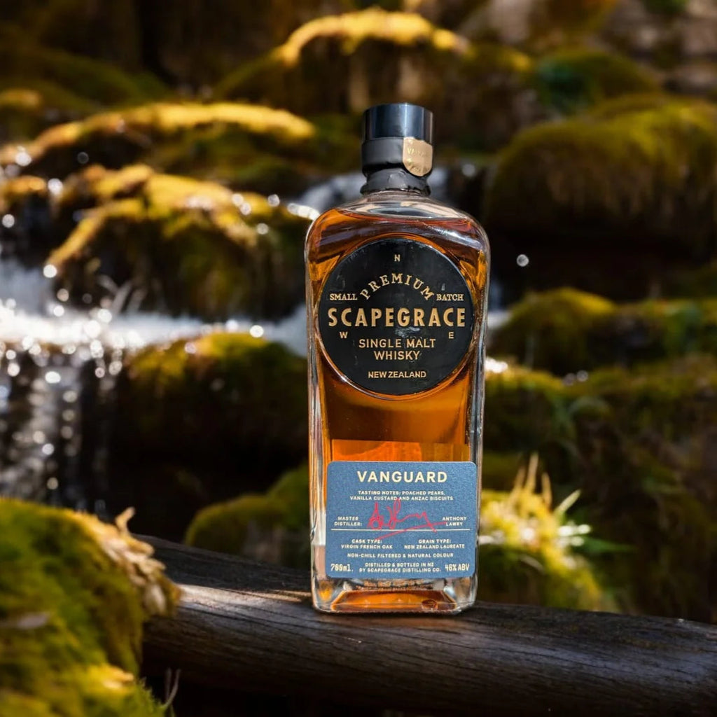 Scapegrace Vanguard Single Malt Whisky bottle on a rock with a natural background