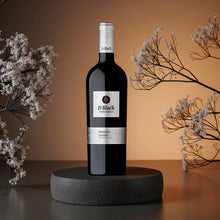 Load image into Gallery viewer, D&#39;Block Reserve Shiraz wine bottle on a dark surface with decorative branches.