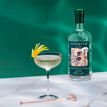 Load image into Gallery viewer, Sipsmith London Dry Gin bottle with a cocktail and garnish on a green background