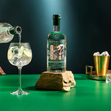 Load image into Gallery viewer, Sipsmith gin bottle with a cocktail being poured on a green background