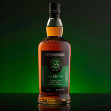 Load image into Gallery viewer, Springbank 15-year-old single malt Scotch whisky bottle on a green background