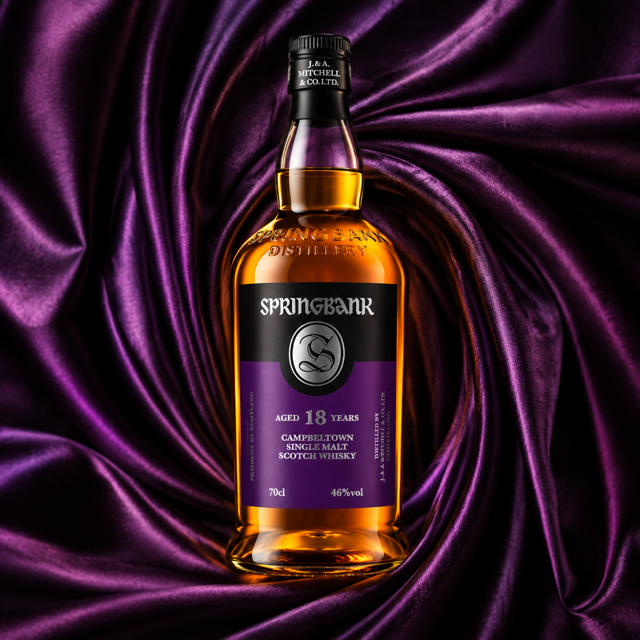 Load image into Gallery viewer, A bottle of Springbank 18 Years Old single malt Scotch whisky, showcasing amber liquid and a black and purple label, set against a draped purple satin fabric background.