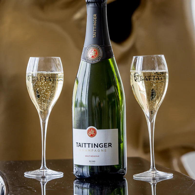 Load image into Gallery viewer, A bottle of Taittinger Brut Reserve Champagne and two full glasses 