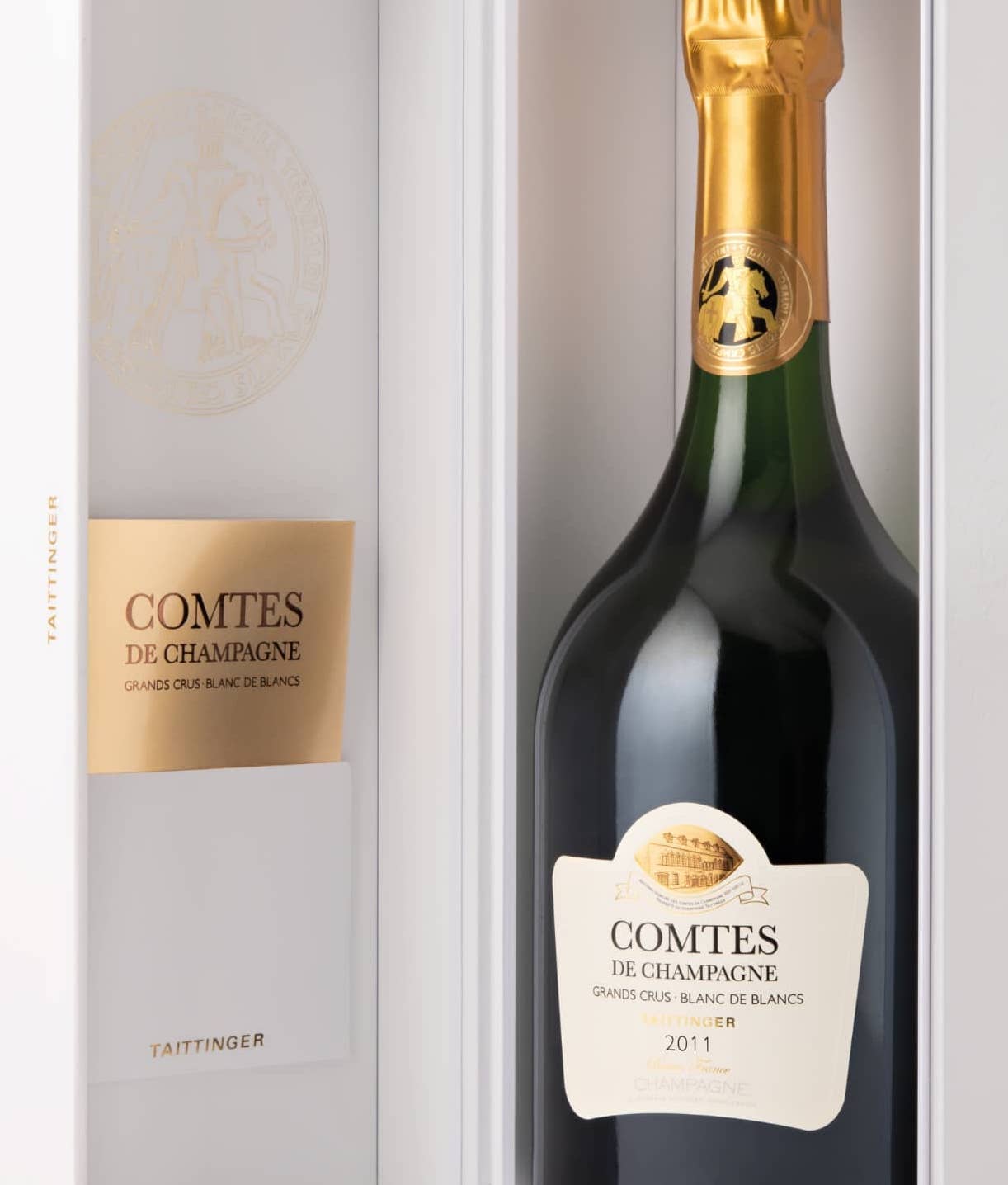 Load image into Gallery viewer, A bottle of Taittinger Comtes de Champagne Blanc de Blancsin its white box