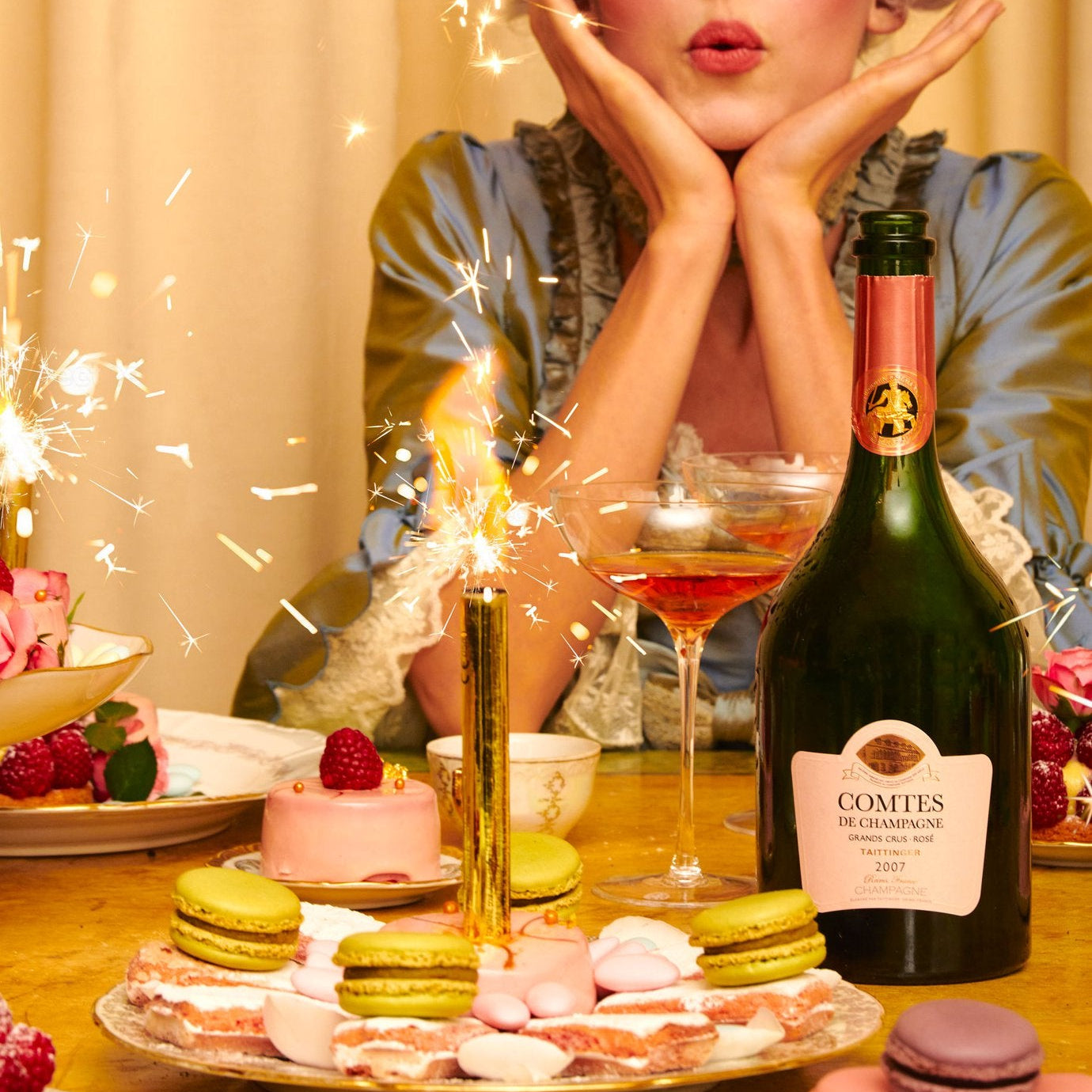 Load image into Gallery viewer, Woman celebrating with champagne and pastries at a table