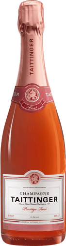 A bottle of Taittinger Prestige Rosé Champagne with a pink label and a shimmering red liquid visible through the transparent bottle.