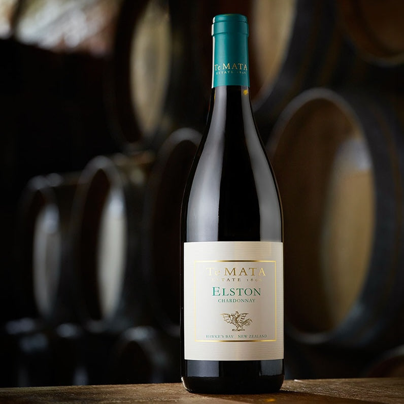 Load image into Gallery viewer, A bottle of A bottle of Te Mata Elston Chardonnay in the winery cellar