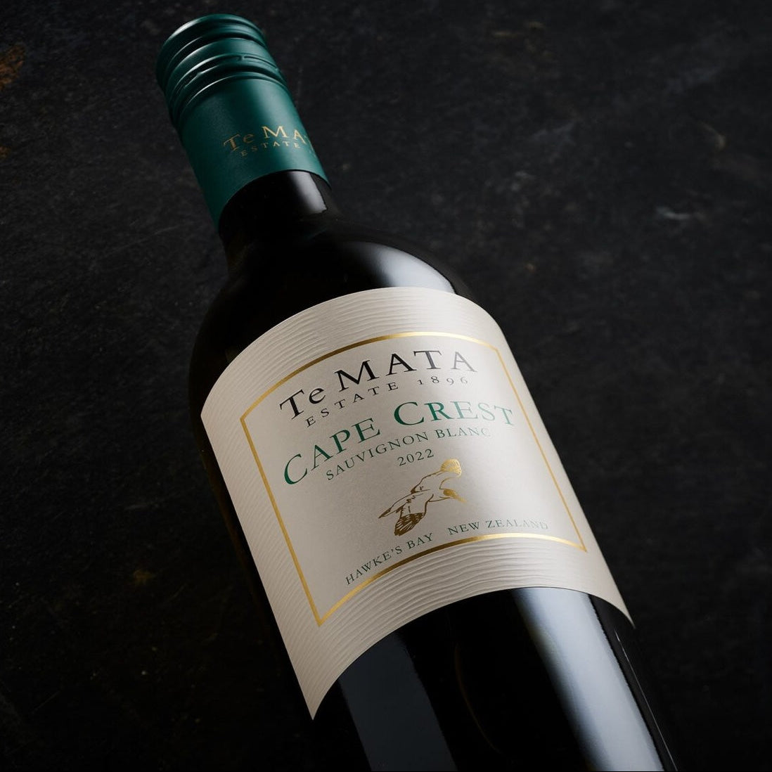 Load image into Gallery viewer, A bottle of Te Mata Estate Cape Crest Sauvignon Blanc on a dark background

