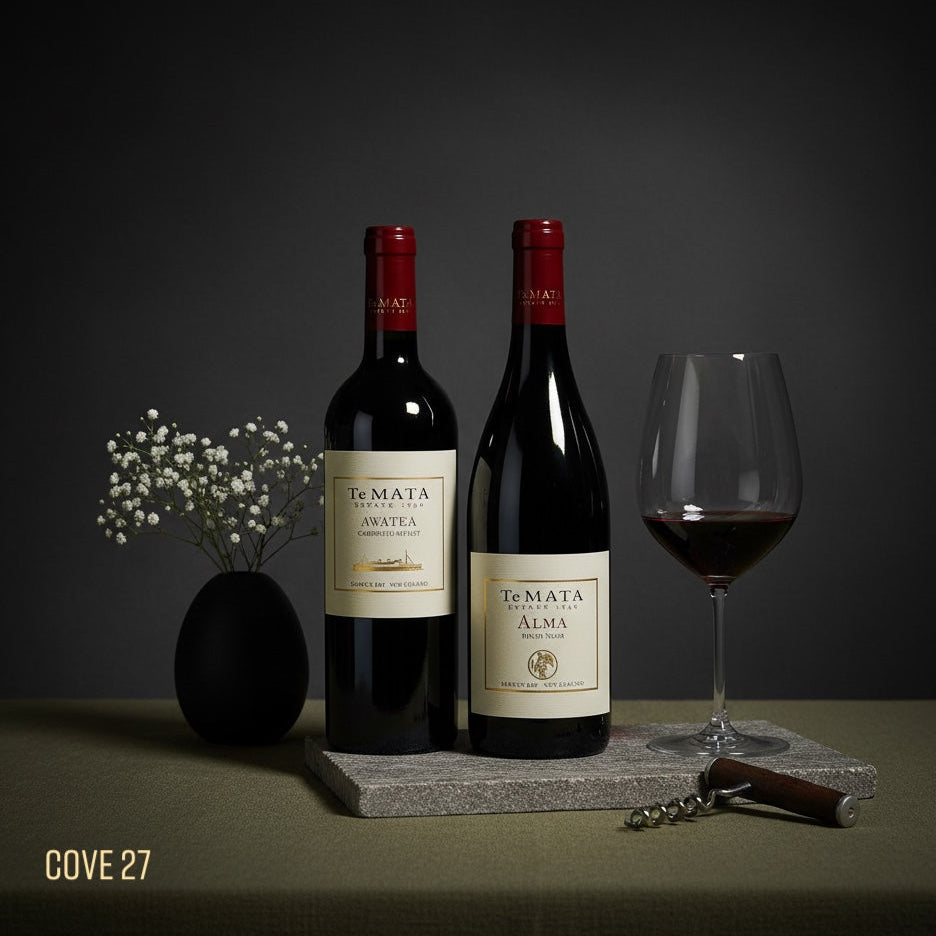 Load image into Gallery viewer, Bottles of Te Mata Estate Alma and Awatea red wine with a glass on a dark background