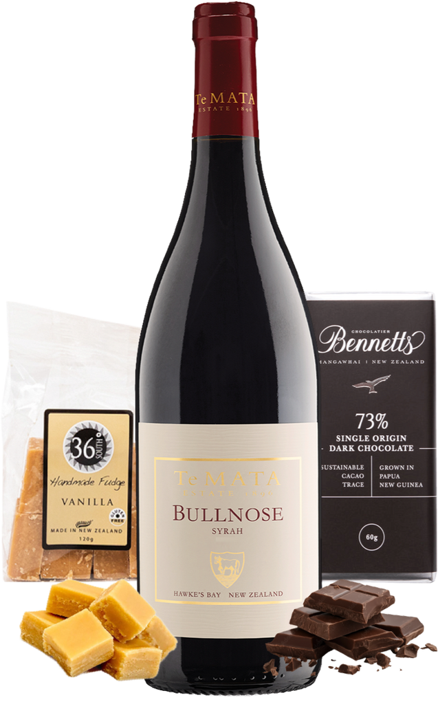 A bottle of Te Mata Estate Bullnose Syrah Red Wine centred on a white background, surrounded by food props: vanilla fudge pieces, a bag of 36 Degrees handmade vanilla fudge, and a bar of Bennett's 73% dark chocolate.