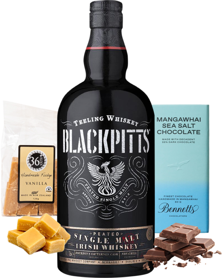 Load image into Gallery viewer, A bottle of Teeling Blackpitts Peated Single Malt Irish Whiskey centred on a white background, surrounded by flavour props: 36 Degrees vanilla fudge packet and vanilla fudge pieces, chocolate chunks, and a blue Bennett's Mangawhai Sea Salt Chocolate bar.