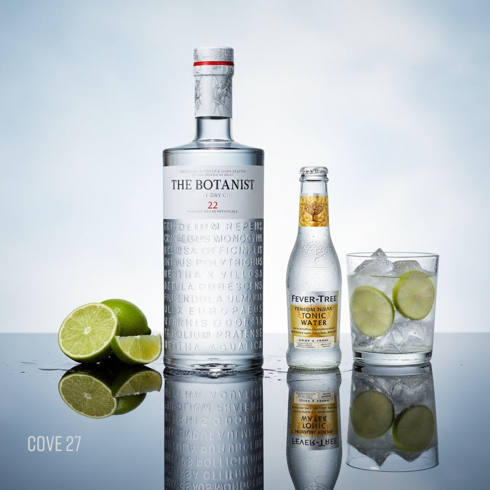 Load image into Gallery viewer, Bottle of 'The Botanist' gin with a bottle of Fever-Tree Indian Tonic Water and a cocktail on a reflective surface.