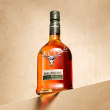 Load image into Gallery viewer, Bottle of Dalmore 15 year old whisky on a beige background
