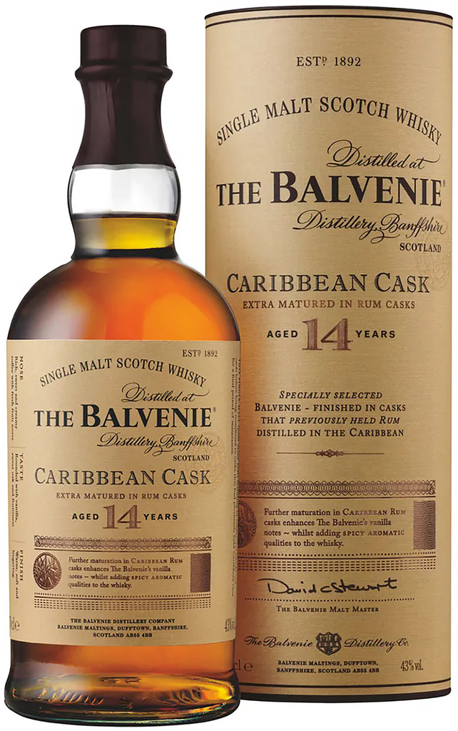 An image of a bottle of The Balvenie Caribbean Cask 14YO Single Malt Scotch Whisky 700ml next to its fine gift tube box