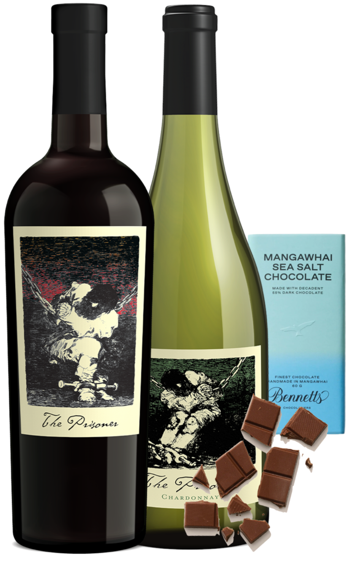 Load image into Gallery viewer, A wine gift set featuring a bottle of The Prisoner Californian Red Blend and Chardonnay white wine, alongside a blue package of Bennett's Mangawhai Sea Salt Chocolate and scattered chocolate pieces on a white background.