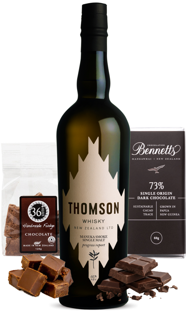 A bottle of Thomson Manuka Smoke Whisky, a bag of 36 Degrees chocolate fudge, a bar of Bennett's 73% dark chocolate, and scattered chocolate pieces in front.