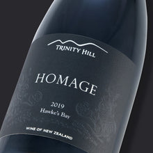 Load image into Gallery viewer, Wine bottle labeled &#39;Homage&#39; by Trinity Hill with a dark background