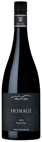 A bottle of Trinity Hill 'Homage' Syrah wine with a black label featuring the Trinity Hill logo.