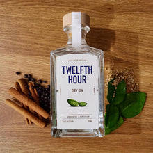 Load image into Gallery viewer, Bottle of Twelfth Hour Dry Gin on a wooden surface with herbs and spices.