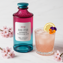 Load image into Gallery viewer, Bottle of Ukiyo Japanese Blossom Gin with a cocktail and cherry blossoms on a light background