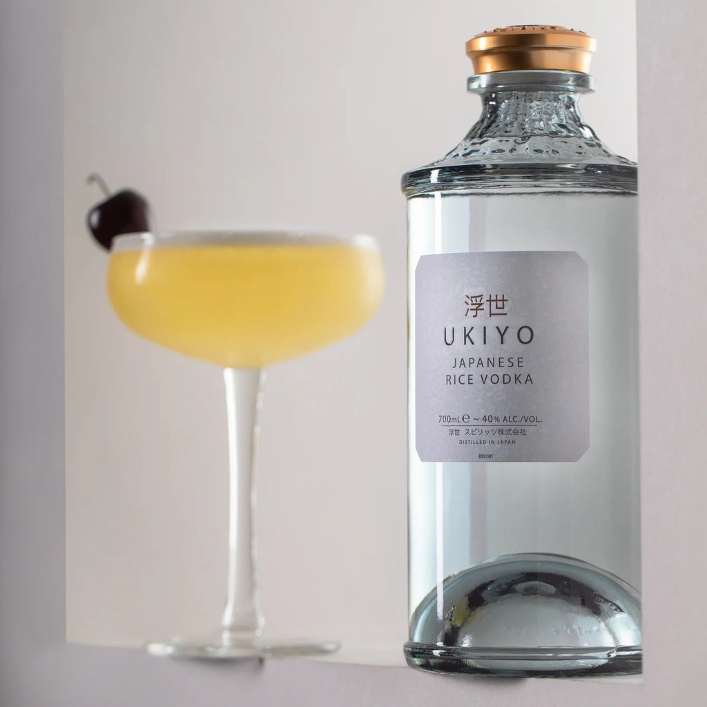 Bottle of Unyo Japanese Vodka with a cocktail in the background