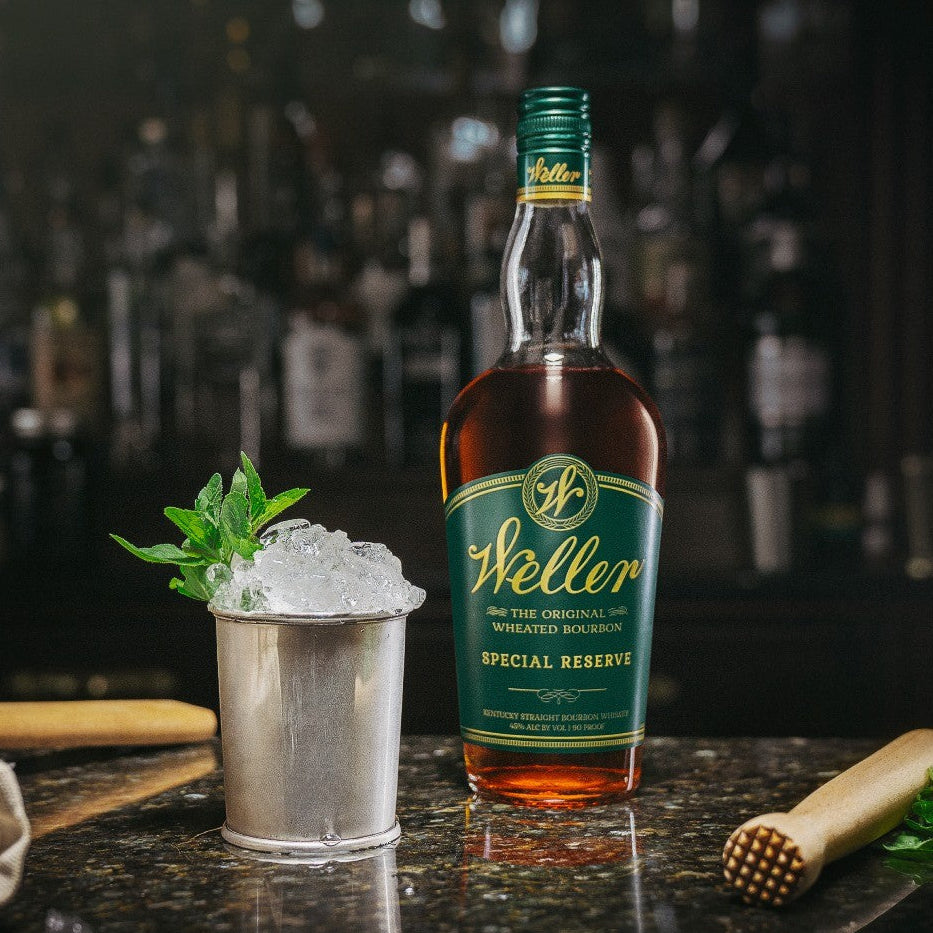Load image into Gallery viewer, Weller Special Reserve bourbon bottle with a cocktail on a bar counter