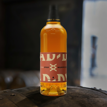 Load image into Gallery viewer, Waiheke-Whisky-Dyad-II-Single-Malt-Whisky-700ml bottle on a wooden barrel