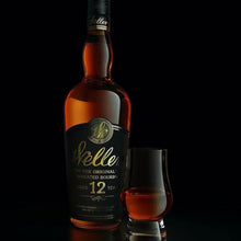Load image into Gallery viewer, A bottle of Weller Whiskey and a tumbler of neat whiskey in it on a black background