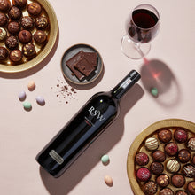 Load image into Gallery viewer, Bottle of Wirra-Wirra-RSW-Shiraz wine with chocolates and a glass of red wine on a pink surface