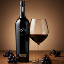 Load image into Gallery viewer, Bottle and glass of red wine with grapes on a wooden surface