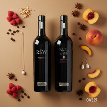 Load image into Gallery viewer, Two Wirra Wirra McLaren Vale RED wine bottles with decorative elements on a brown background