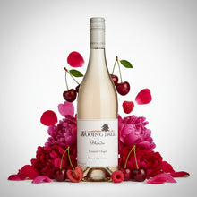 Load image into Gallery viewer, Bottle of Wooing Tree Blondie Rose wine surrounded by flowers and cherries on a white background
