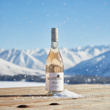 Load image into Gallery viewer, Bottle of Wooing Tree Blondie Rose wine on a wooden surface with snow-covered mountains in the background